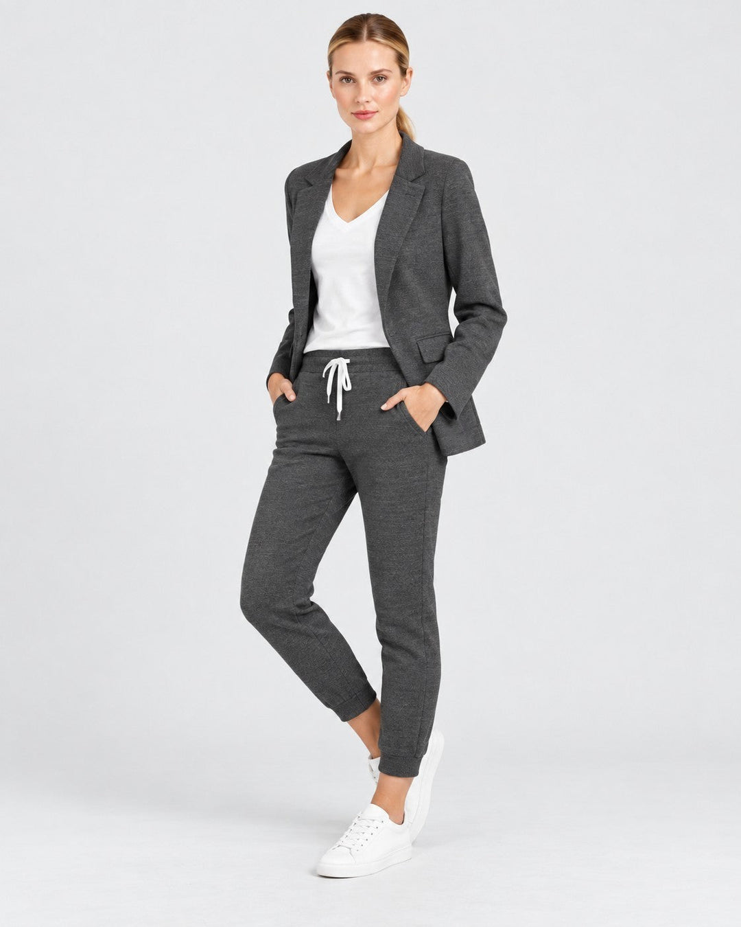 Luna Moda Fiorenza charcoal grey blazer and jogger set worn by a model with a white t-shirt and sneakers.