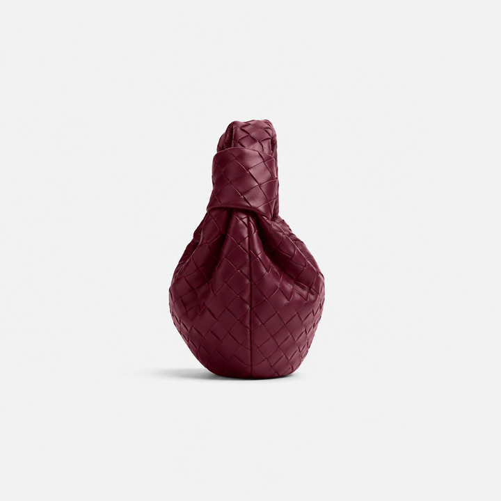 CHIARA di Luna Moda, borsa intrecciata con nodo, colore bordeaux, vista laterale.