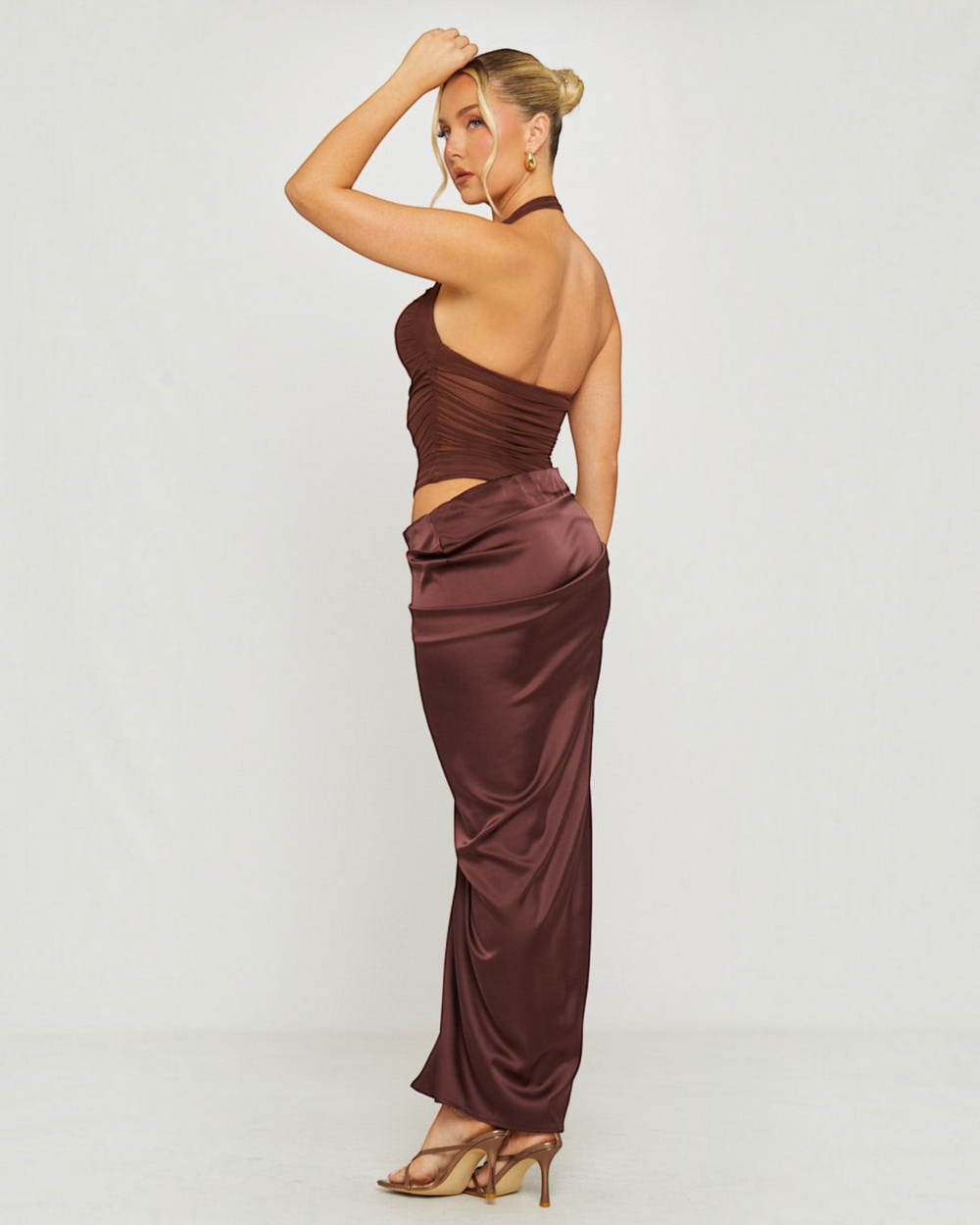 Luna Moda cocoa brown maxi dress with sheer mesh bodice, halter neckline, and silky satin skirt, side view