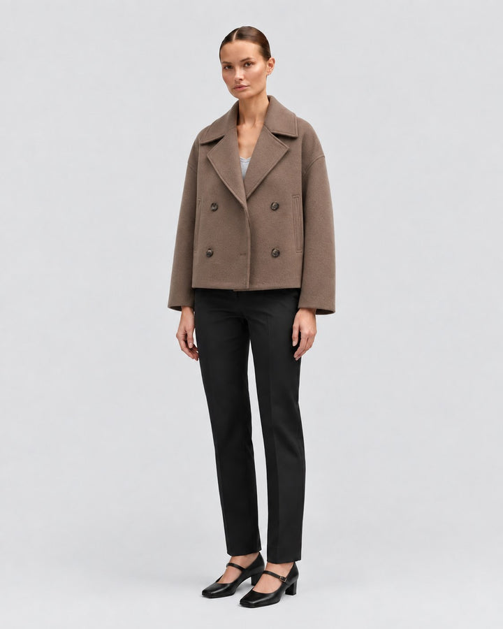 Luna Moda Costanza brown double-breasted short jacket worn by a model with black trousers and heels