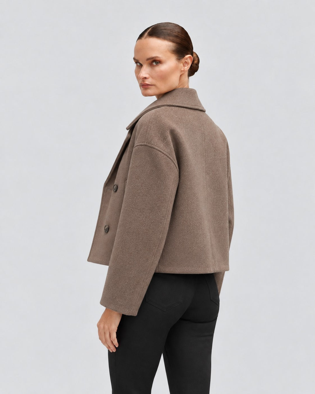 Luna Moda Costanza brown double-breasted short jacket worn by a model, back view showing structured wool-blend fabric