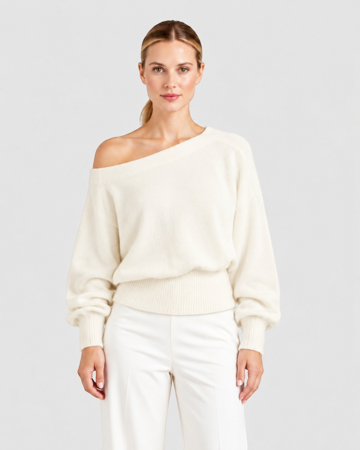 Luna Moda off-shoulder cream knit sweater with long draped sleeves and a fitted waist worn by a model