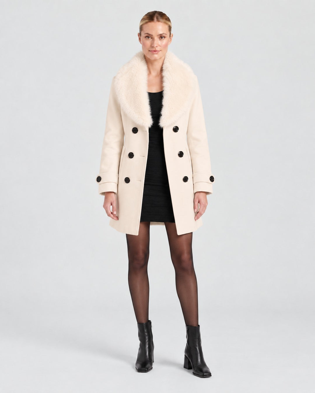 Luna Moda cream short tailored winter coat with a faux fur collar and double-breasted button closure on a model