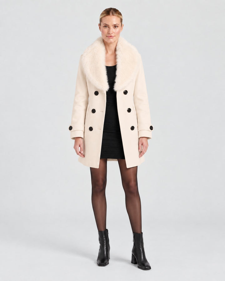 Luna Moda cream short tailored winter coat with a faux fur collar and double-breasted button closure on a model