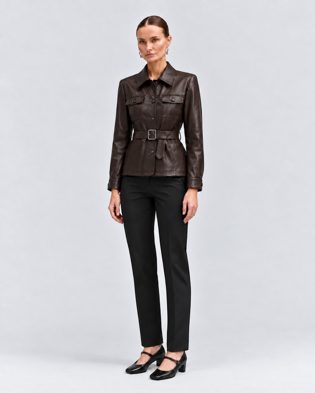 Luna Moda Cristiana dark brown PU leather jacket with adjustable waist belt, front pockets, and classic collar.