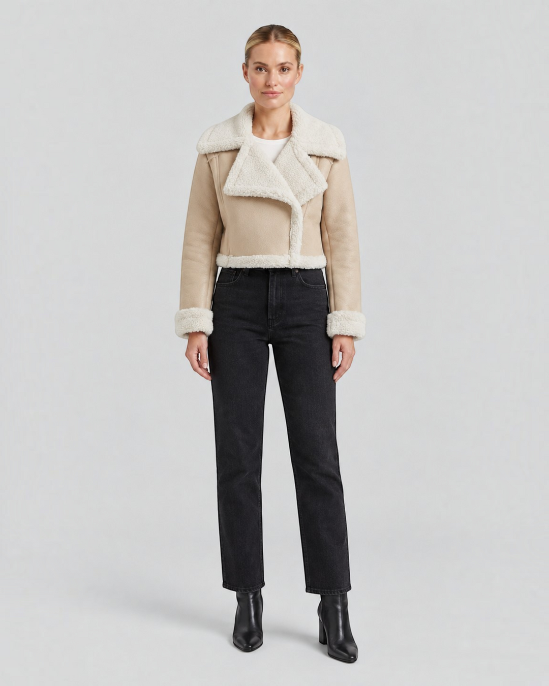 Luna Moda cropped beige faux shearling jacket with a wide collar and fleece lining worn by a model.