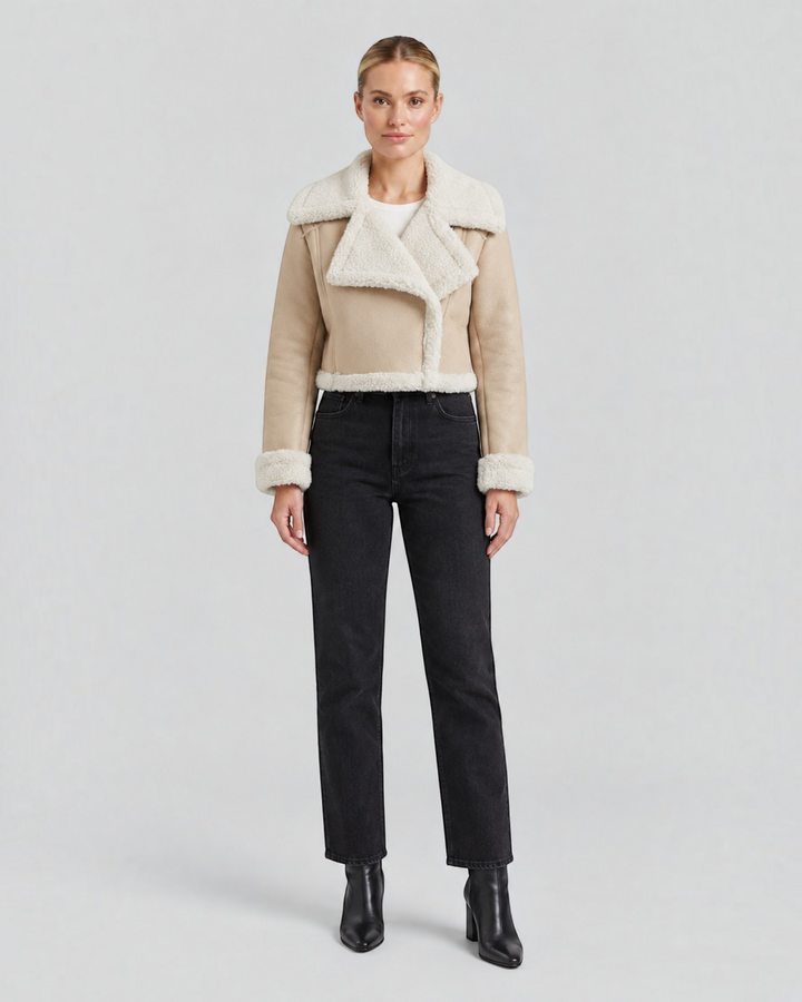 Luna Moda cropped beige faux shearling jacket with a wide collar and fleece lining worn by a model.