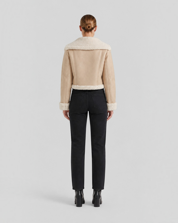 Luna Moda cropped beige faux shearling jacket with white fleece lining, back view on a model with black jeans.
