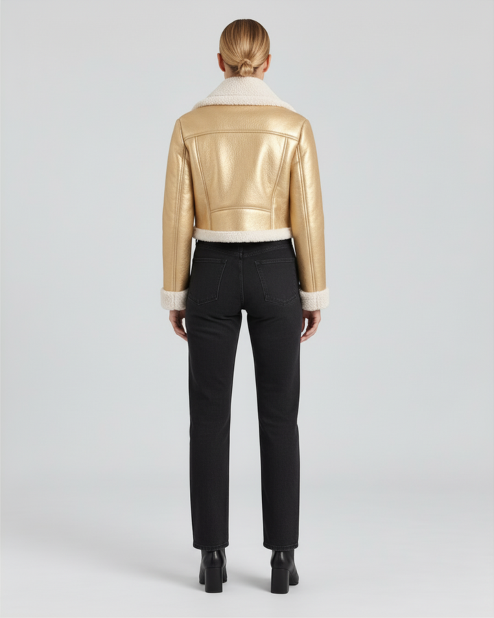 Luna Moda Mariella cropped gold metallic jacket with white fleece lining, back view on a model