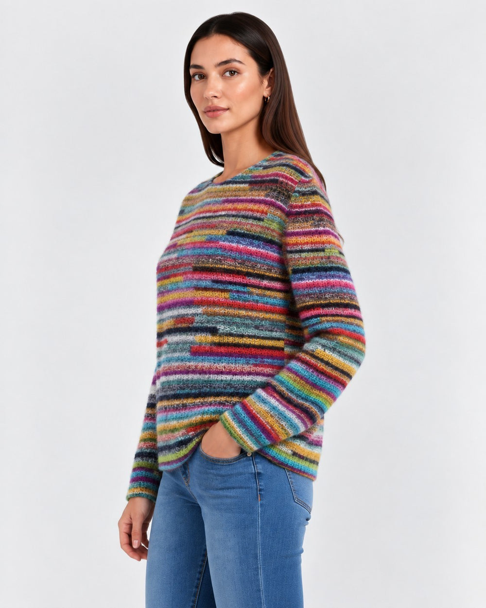 Luna Moda Daniela retro striped sweater with vibrant multi-colored knit pattern worn by a woman with blue jeans