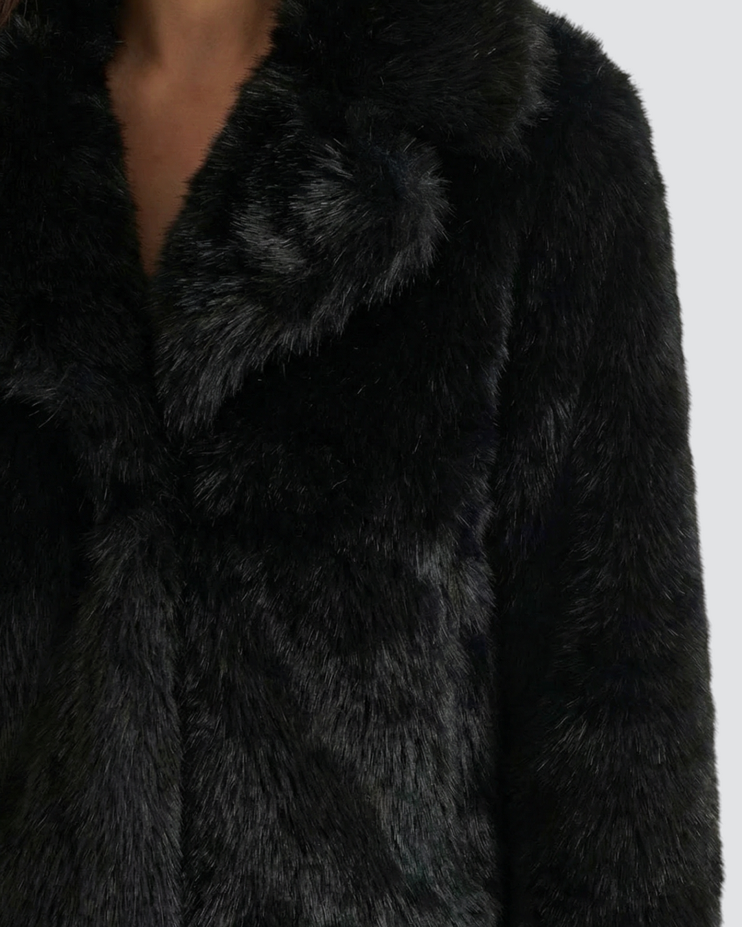 Luna Moda black faux fur cropped jacket with a soft, plush texture and wide collar worn by a model