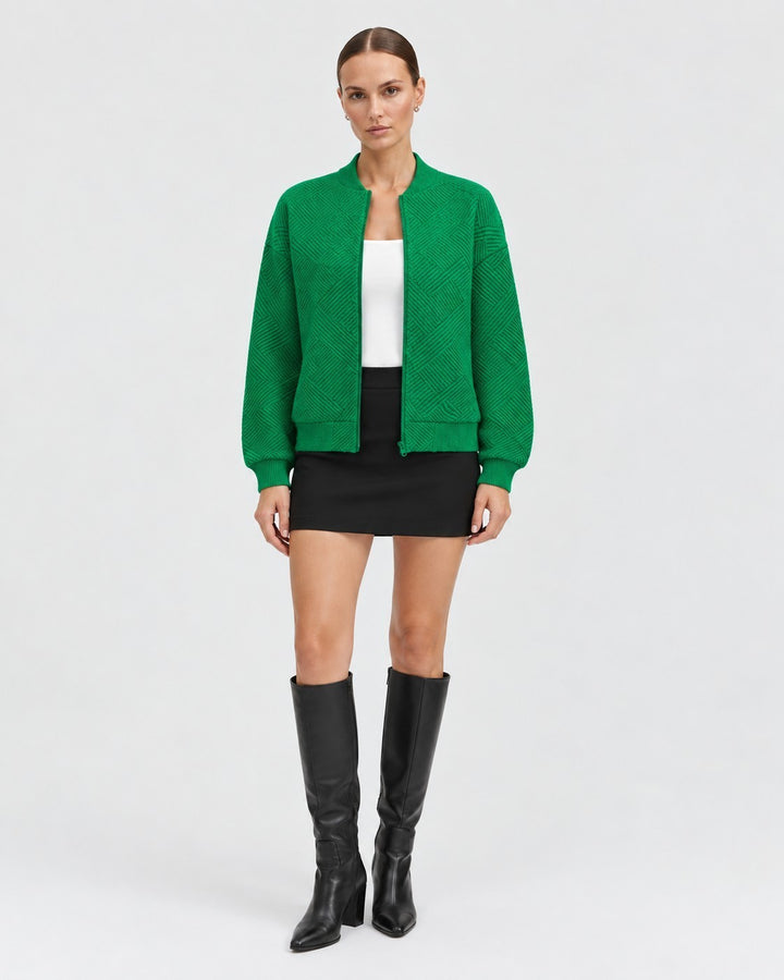 Luna Moda Dora green bomber jacket with a geometric pattern, ribbed cuffs, and front zip closure worn by a model.