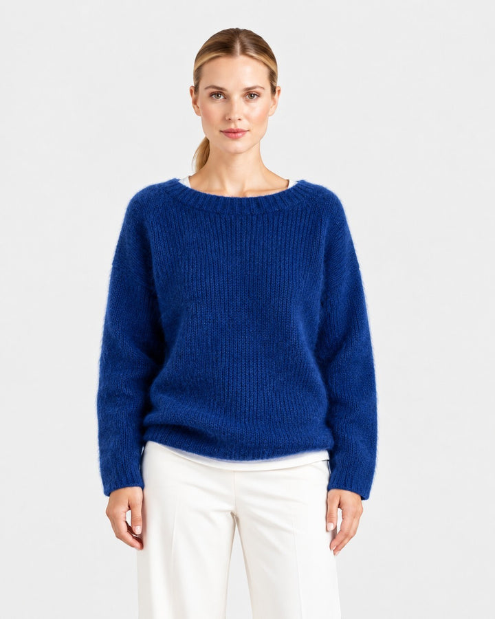 Luna Moda Elda blue crew neck sweater with a soft, relaxed fit worn by a model against a white background.