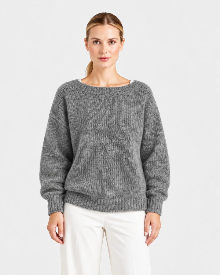 Luna Moda Elda grey crewneck sweater with a soft, relaxed fit worn by a model against a plain light background.