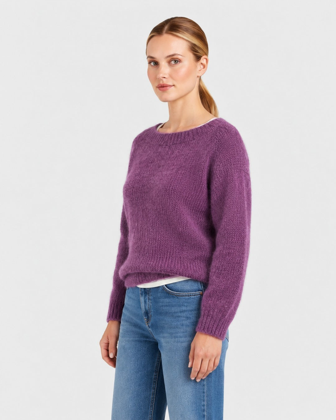 Luna Moda Elda purple crew neck sweater with a soft, fuzzy knit texture worn by a model with blue jeans.