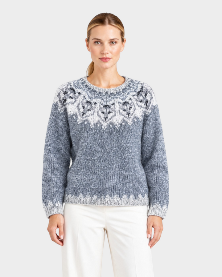 Luna Moda Elisabetta handmade grey wool sweater with white sheep pattern and round neckline worn by a woman