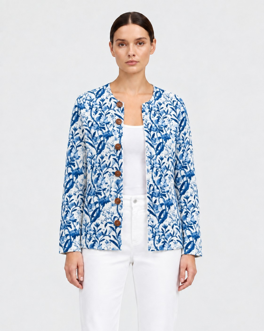Luna Moda Emilia blue and white botanical print cardigan with wooden buttons worn over a white top and trousers