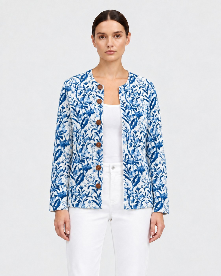 Luna Moda Emilia blue and white botanical print cardigan with wooden buttons worn over a white top and trousers