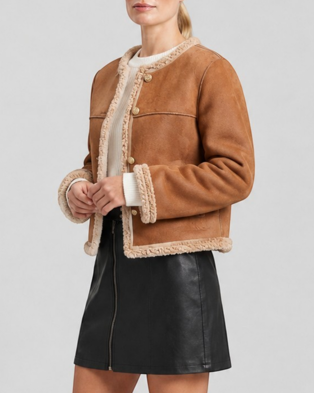 Luna Moda ESTER winter jacket in tan suede with cream faux shearling lining worn by a model with a black skirt