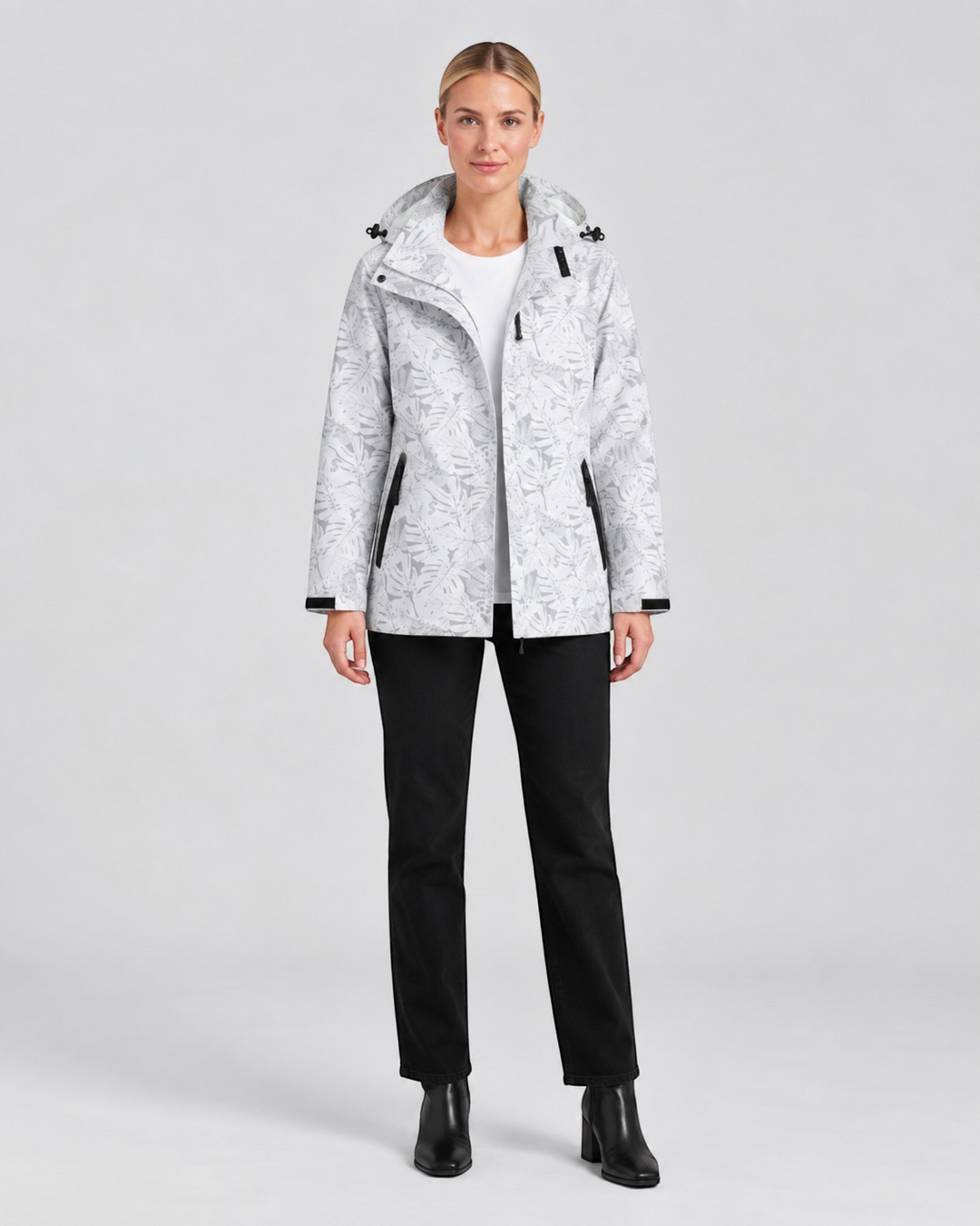 Luna Moda Eufemia lightweight waterproof hooded jacket with grey leaf pattern worn by a model with black trousers