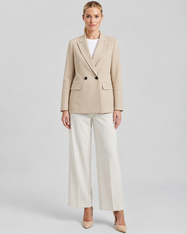 Luna Moda Felicia long beige double-breasted blazer with padded shoulders and tailored waist worn by a model