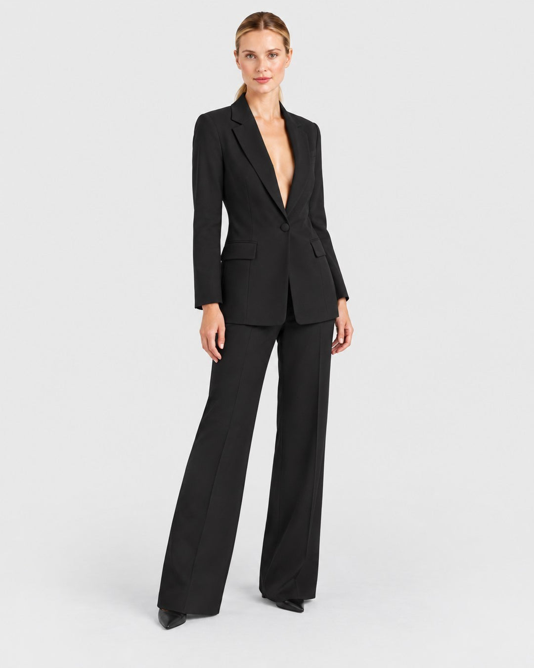 Luna Moda Fernanda black structured blazer and straight-leg trousers suit worn by a model on a white background
