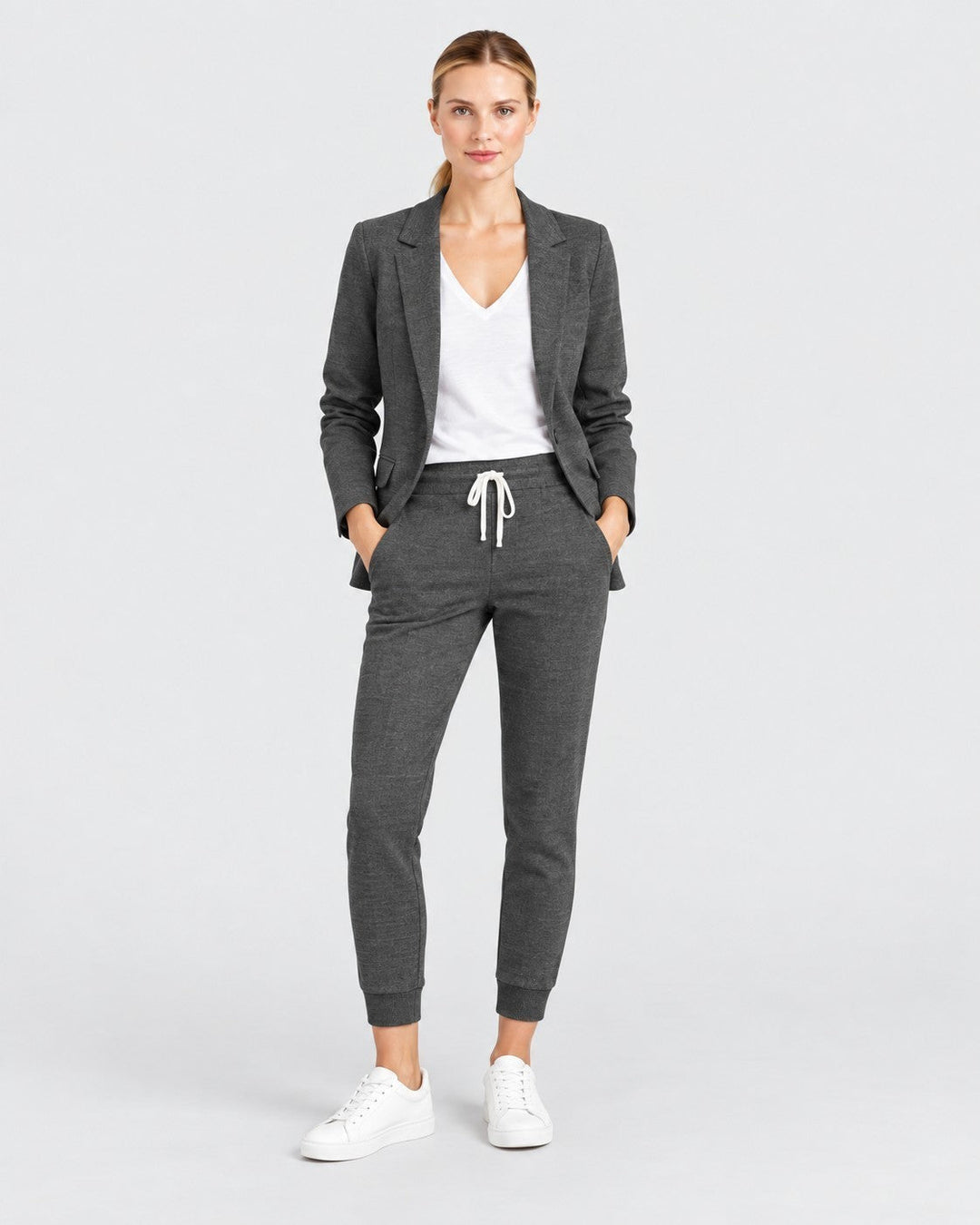 Luna Moda Fiorenza charcoal grey blazer and jogger pant set worn by a woman with a white t-shirt and sneakers.