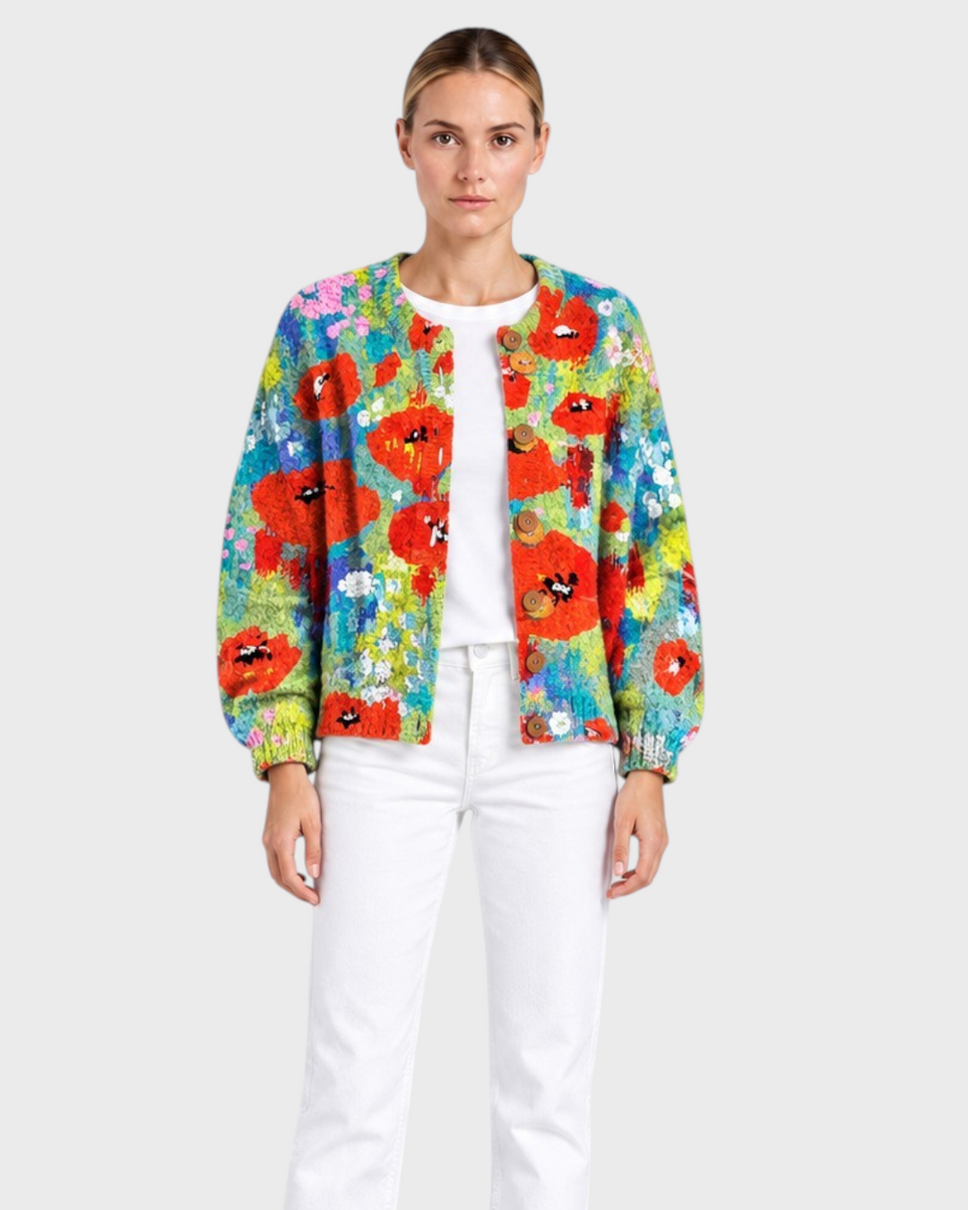 Luna Moda floral patchwork cardigan with wooden buttons worn by a model with white jeans and black boots