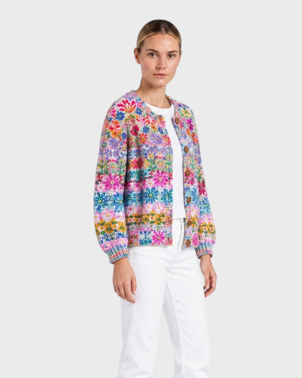 Luna Moda floral patchwork cardigan with wooden buttons worn by a model with white jeans and black boots