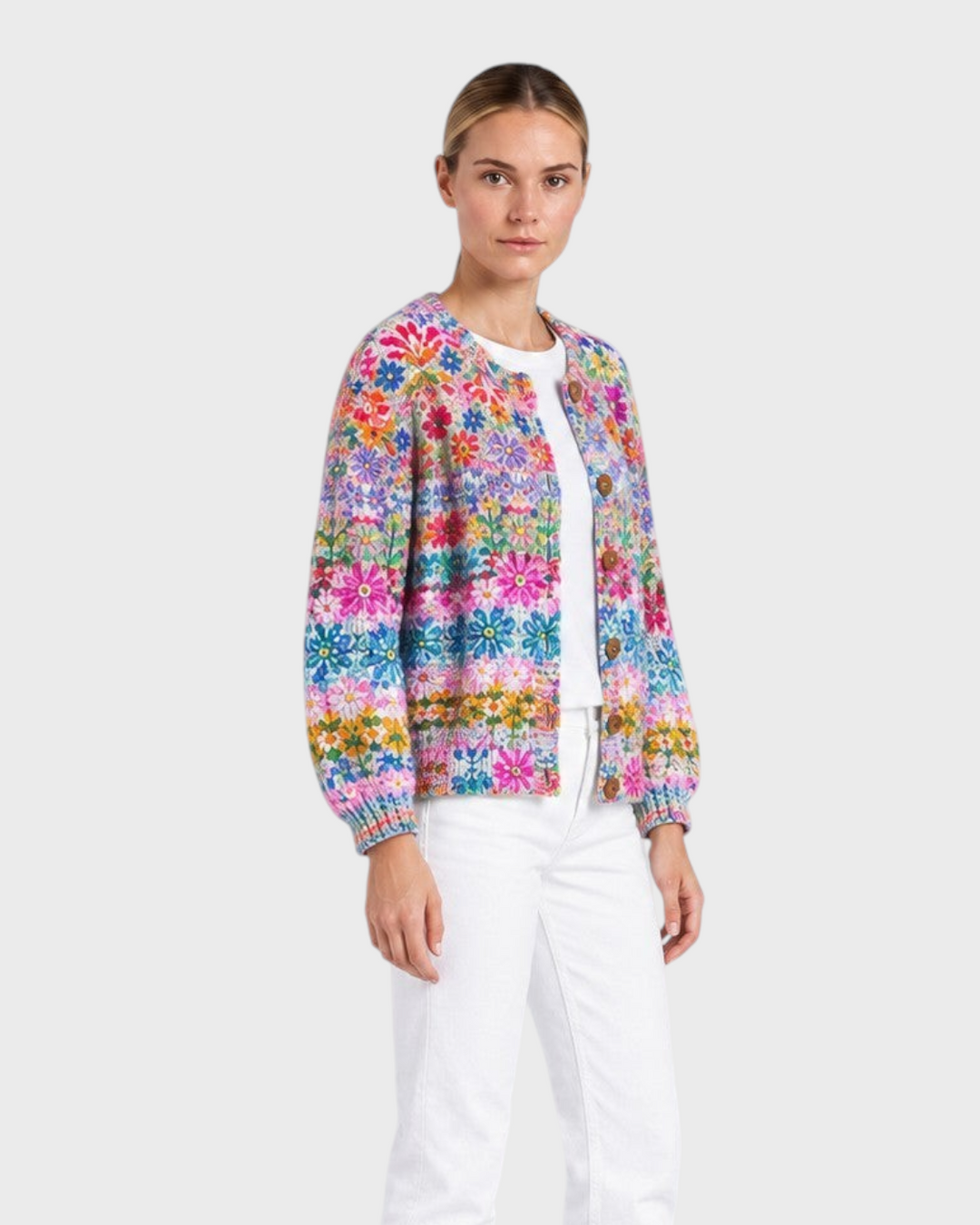 Luna Moda floral patchwork cardigan with wooden buttons worn by a model with white jeans and black boots