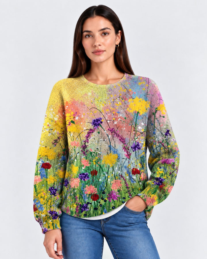 Luna Moda handmade sweater featuring a vibrant multi-colored floral print on a soft knit fabric worn by a model.