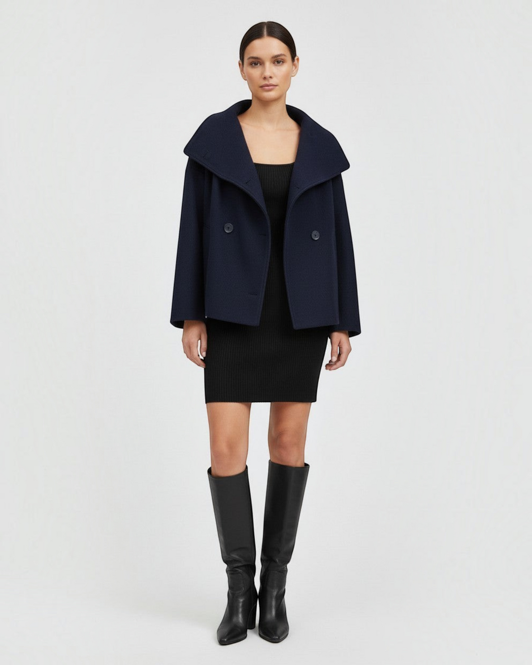 Luna Moda Francisca navy blue mid-season coat with wide lapels and double-breasted button closure on a model