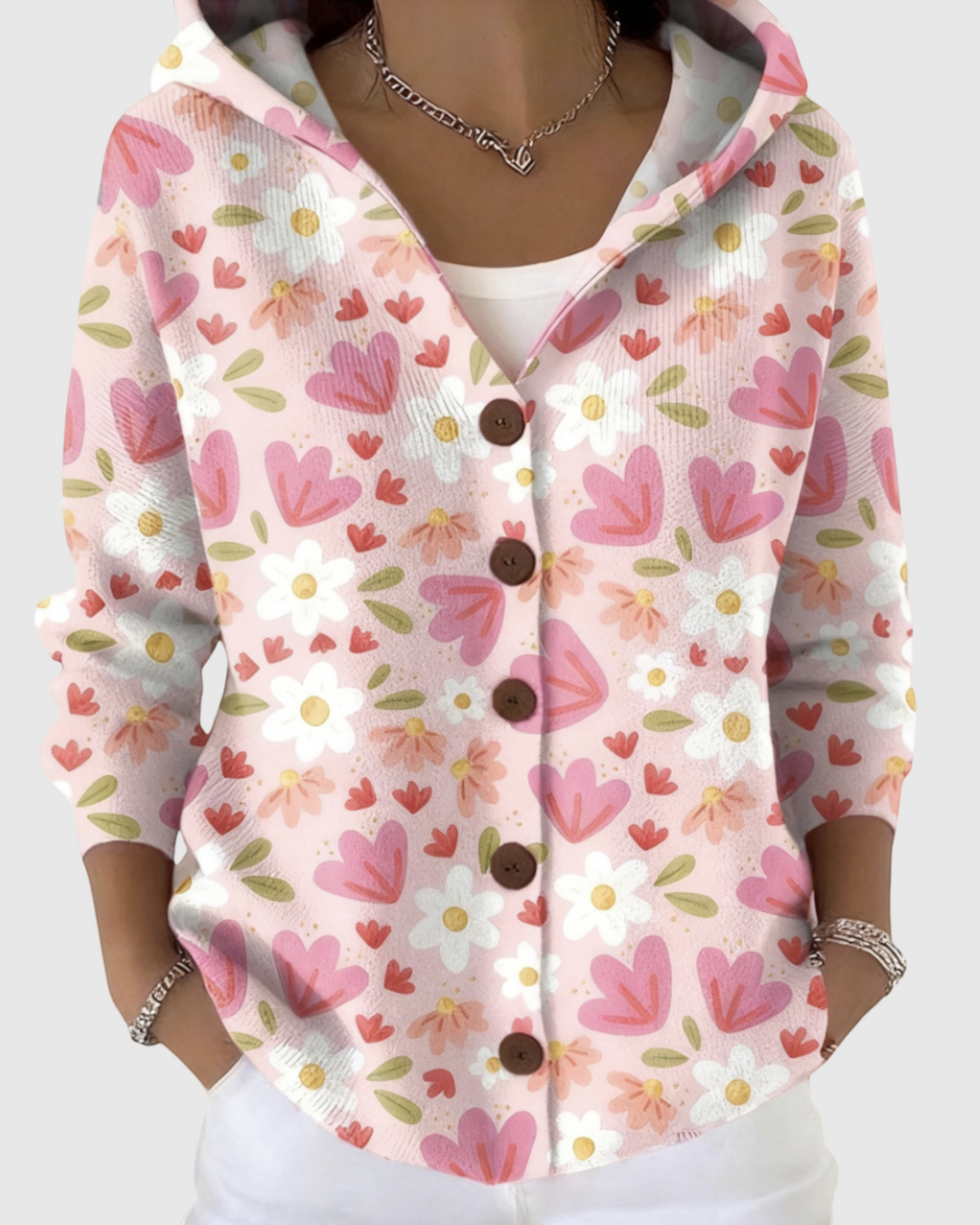 Luna Moda Gaia hooded cardigan in soft pink with a floral and heart pattern, featuring brown buttons and long sleeves.