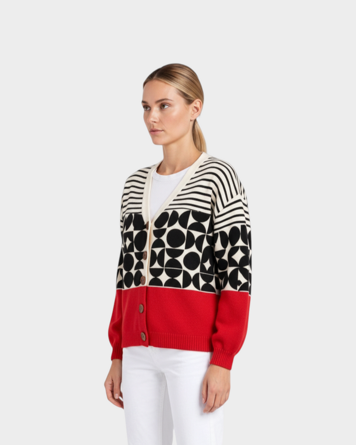 Luna Moda Greta button-up cardigan featuring a geometric black, white, and red knit pattern on a model