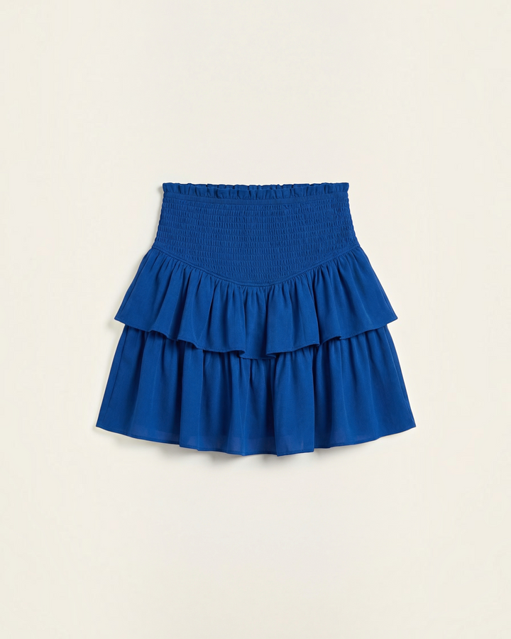 Luna Moda royal blue mini skirt with a high-waisted smocked bodice and layered ruffled hem for a playful silhouette.