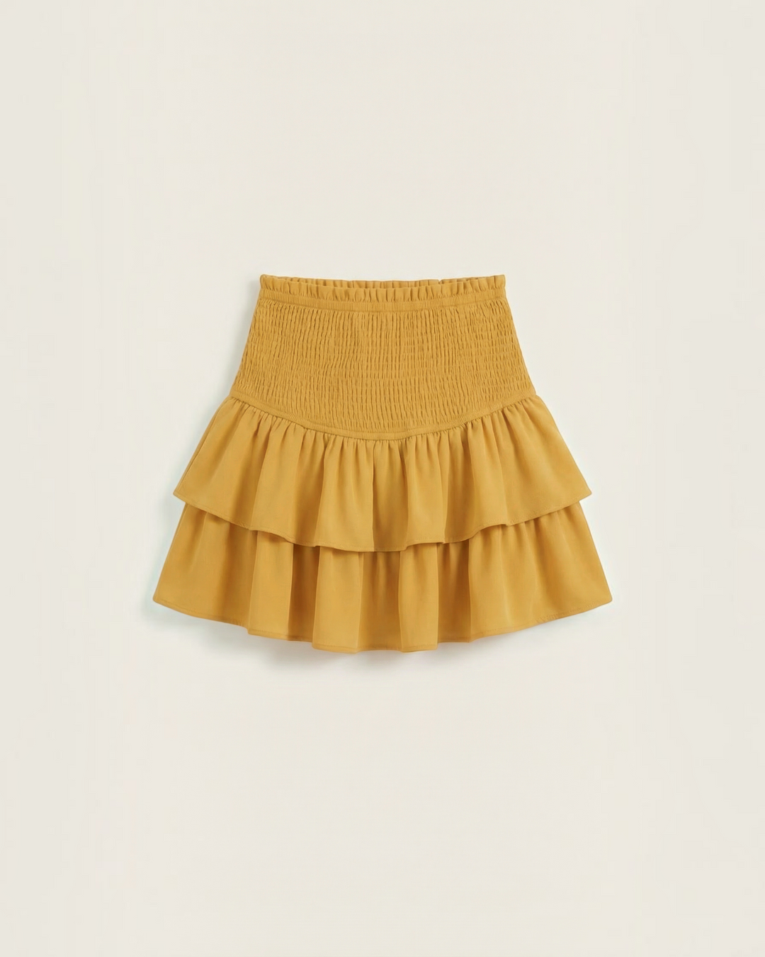 Luna Moda mustard yellow mini skirt with a high-waisted smocked waistband and double-layered ruffled hem.