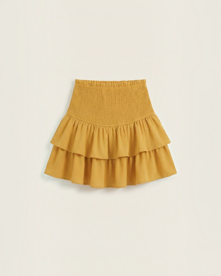 Luna Moda mustard yellow mini skirt with a high-waisted smocked waistband and double-layered ruffled hem.