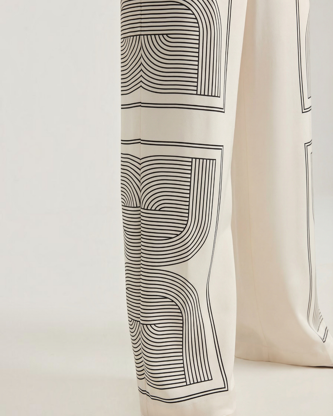 Luna Moda Demetra wide-leg trousers in cream with a black geometric line art graphic print on soft lightweight fabric