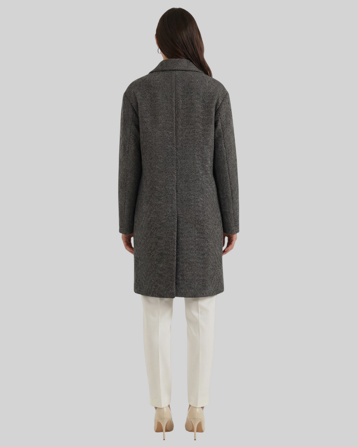 Luna Moda ANNALENA long grey herringbone trench coat with lapels, back view on a model wearing white trousers.