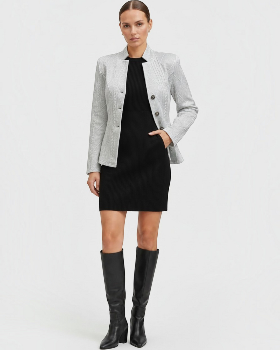 Luna Moda Grazia light grey textured mid-season coat worn over a black dress with knee-high boots