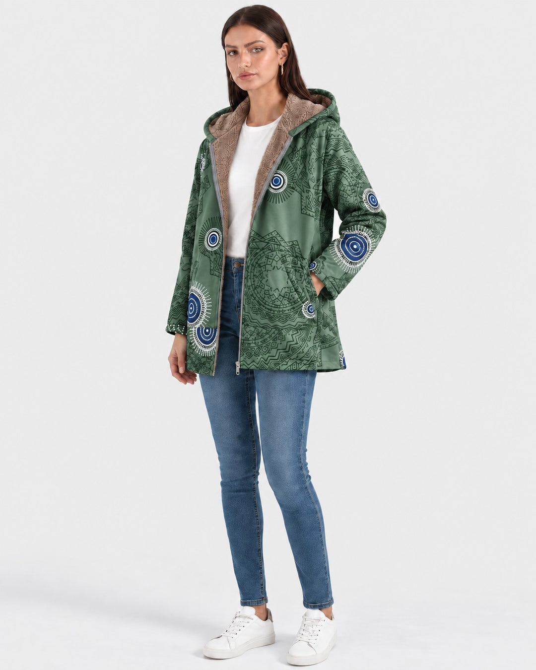 Luna Moda green hooded jacket with geometric boho pattern and soft sherpa lining worn by a model with jeans
