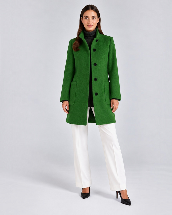 Luna Moda green high-neck wool coat worn by a model with white trousers and black heels