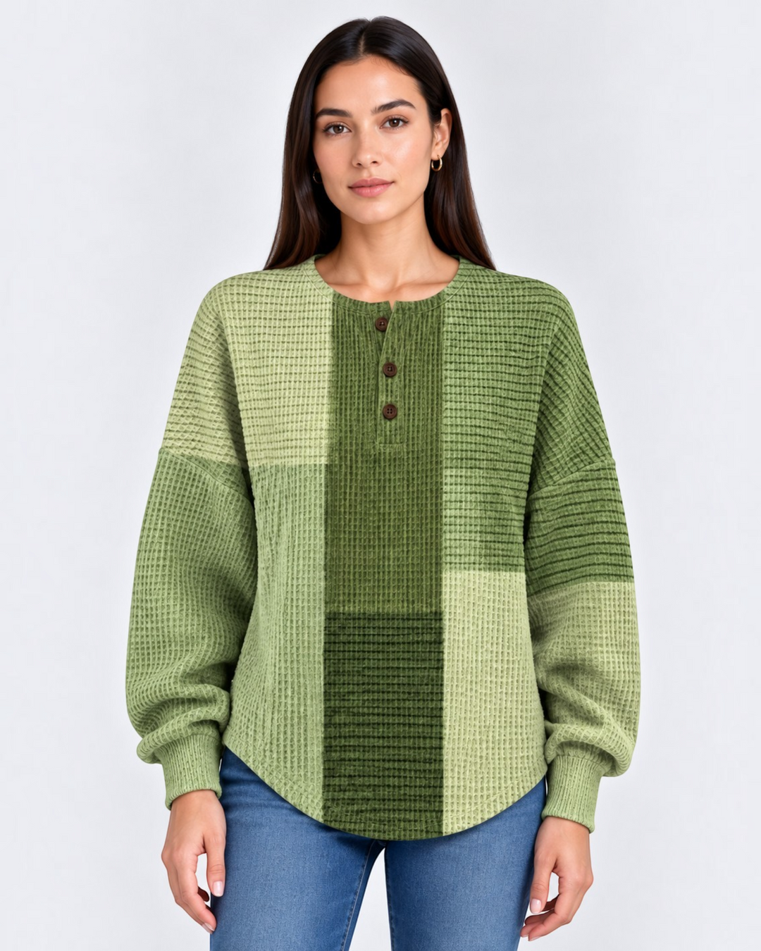 Luna Moda Marcella green waffle knit Henley sweater with a relaxed fit and buttoned placket worn by a woman.