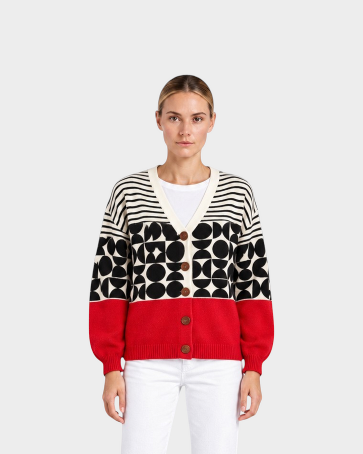 Luna Moda Greta cardigan featuring a geometric black, white, and red pattern with a button-up front on a model.