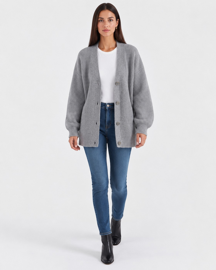 Luna Moda grey cashmere V-neck cardigan worn by a model with a white t-shirt, blue jeans, and black boots.