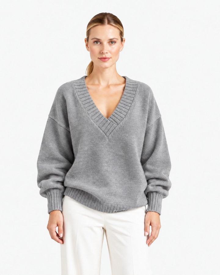 Luna Moda Nadia grey relaxed fit cashmere blend sweater with a deep V-neck and long sleeves worn by a model