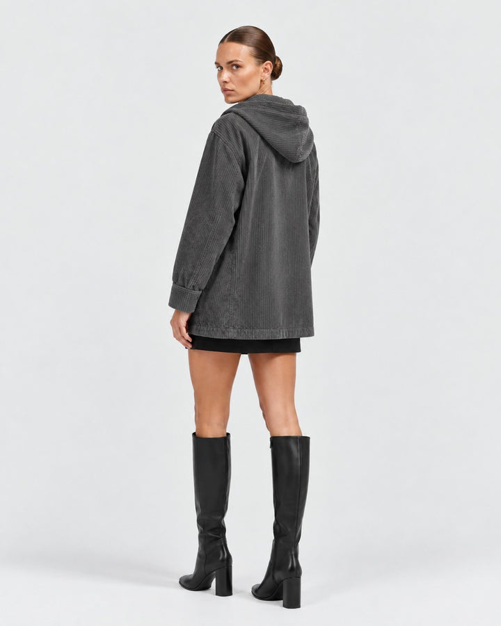 Luna Moda grey corduroy hooded jacket with button closure worn by a model with black knee-high boots