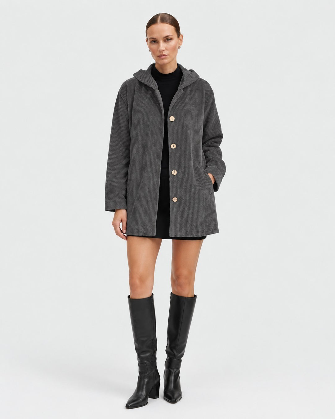 Luna Moda grey corduroy hooded jacket with button closure worn by a model with black dress and knee-high boots