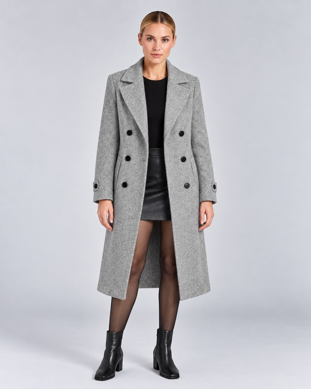 Luna Moda grey double-breasted long wool coat worn by a model with a black top and skirt for a sophisticated look.