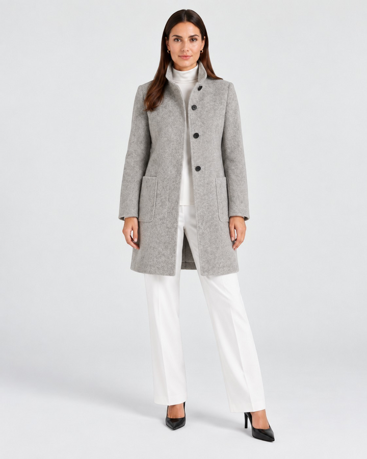 Luna Moda NELLA grey high-neck wool coat worn by a model with white trousers and black heels